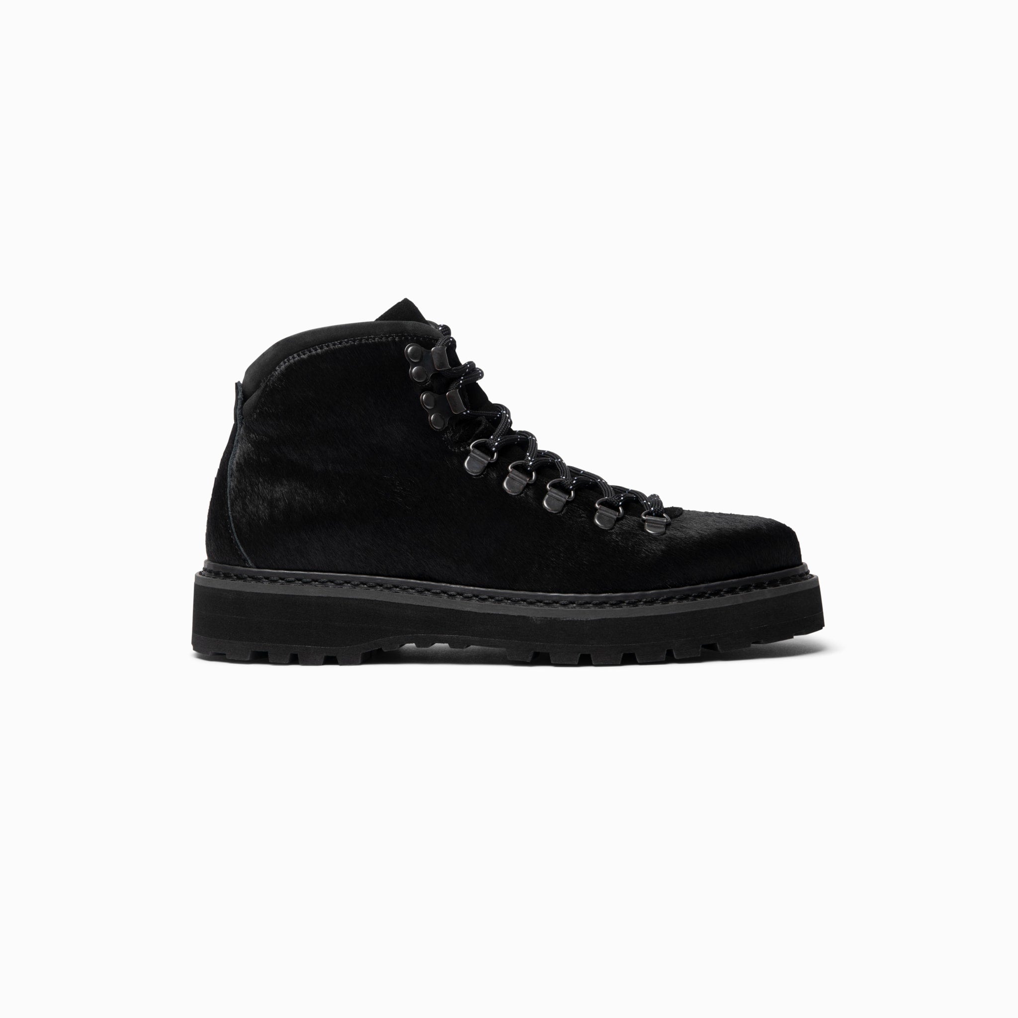 A black classic hiking boot with lace-up closure, made from premium materials, designed for women.