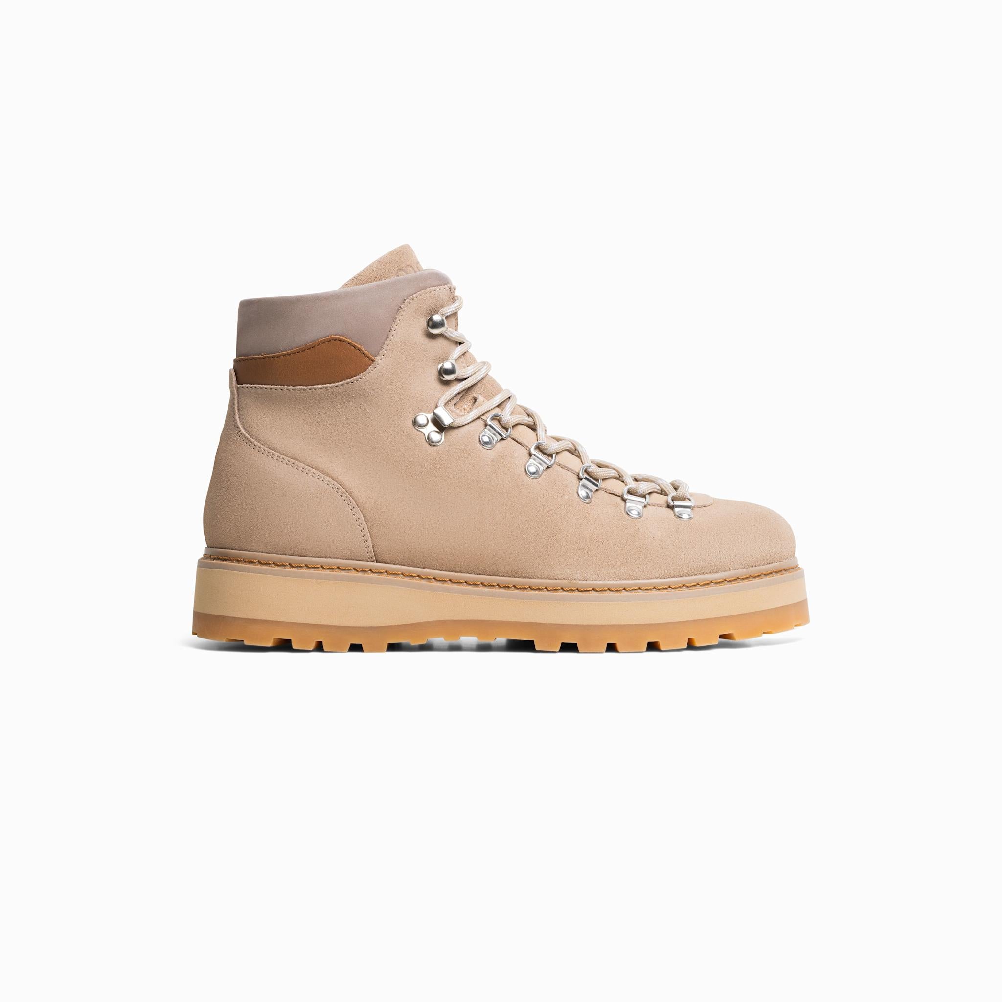 Beige hiking boot on a white background